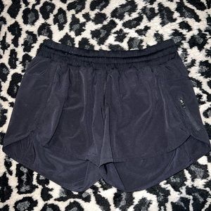 Lululemon track that low rise lined black shorts. Size 10.